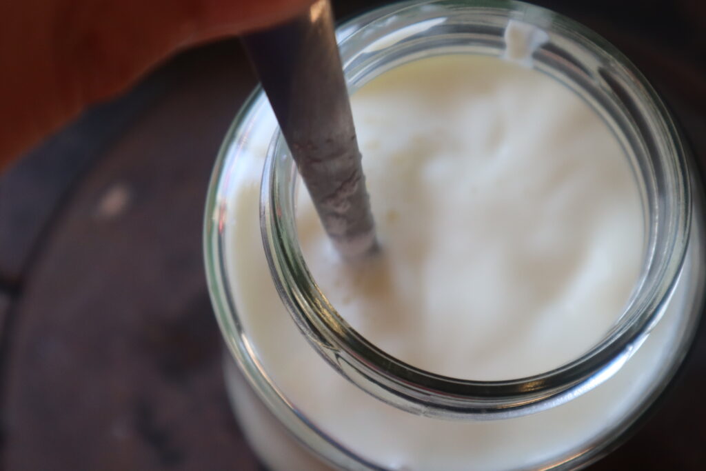mixing milk with a spoon 