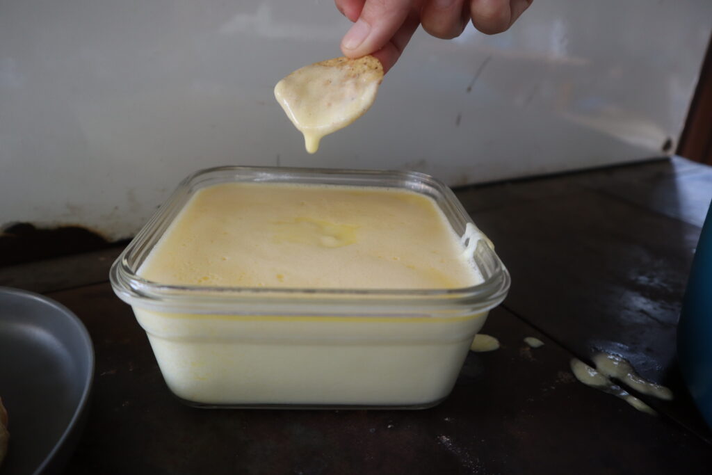 Dipping a chip in cheese 
