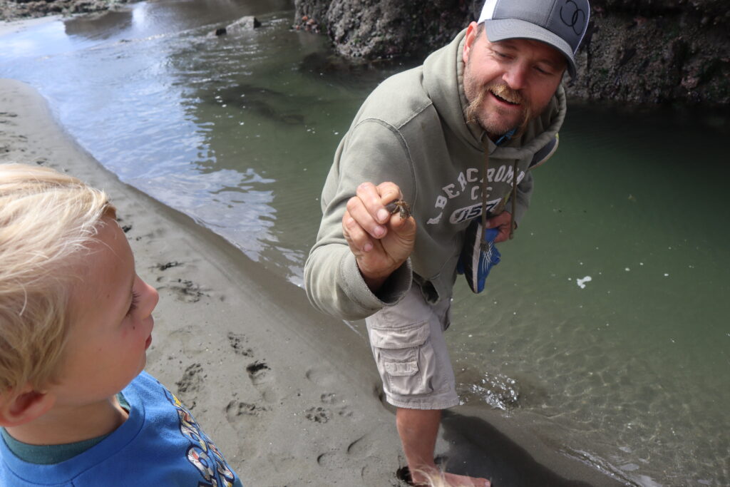 man holding a crab up 
